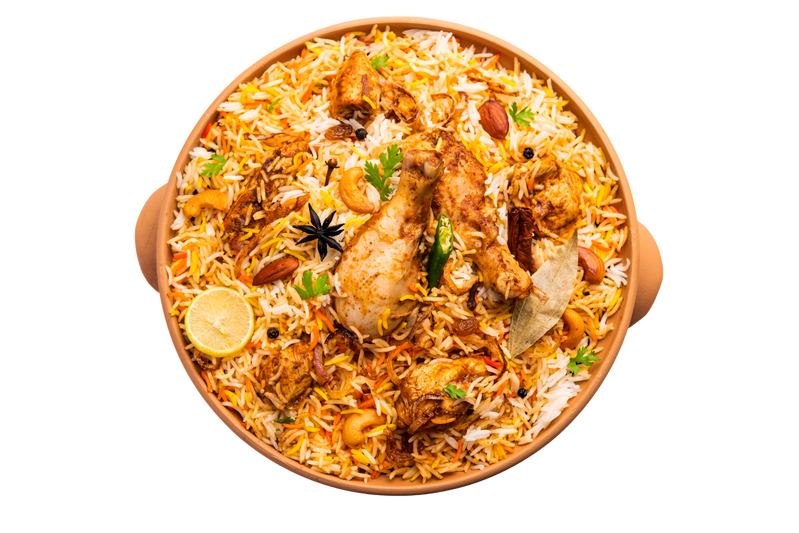 Indian curry served with rice and herbs